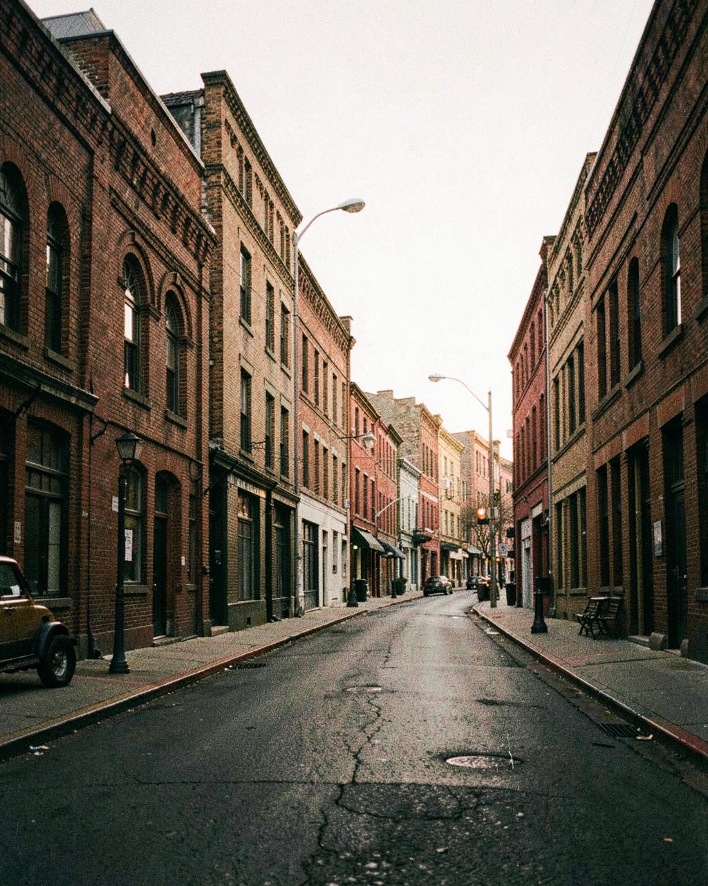 Historic brick warehouse street in a Nashville neighborhood at dusk